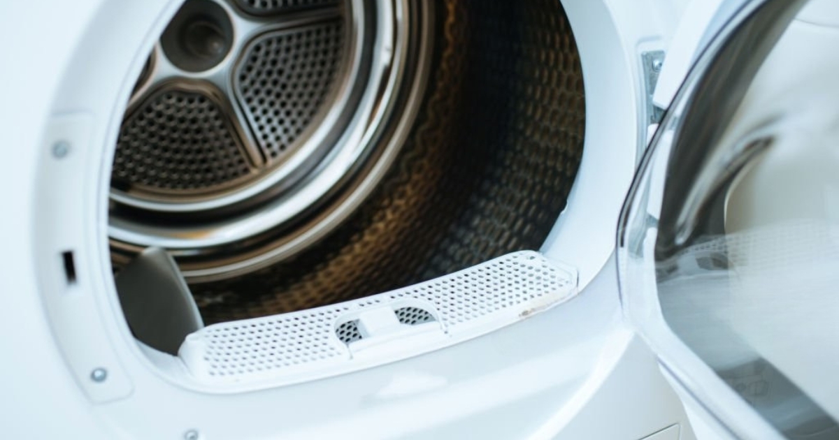 Close-up view of an open dryer drum, highlighting potential causes of a dryer not heating – Troubleshooting and repair tips for fixing heating issues