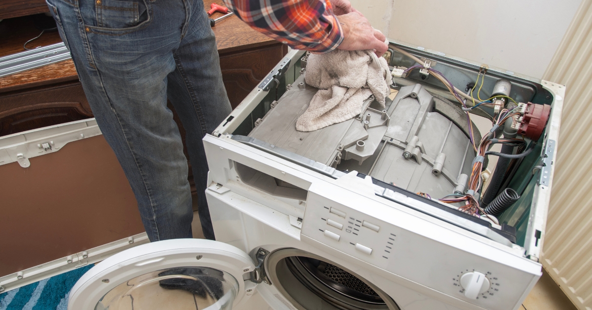 Certified technician diagnosing an LG washer that won't spin properly. Expert washer repair service troubleshooting issues like unbalanced loads, faulty motor, or clogged drain pump